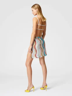 Cover-up miniskirt with lamé wave motif and slit