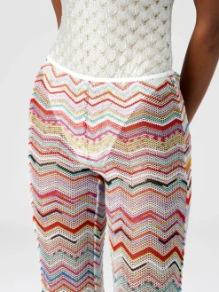 Flared trousers in zigzag crochet with lurex