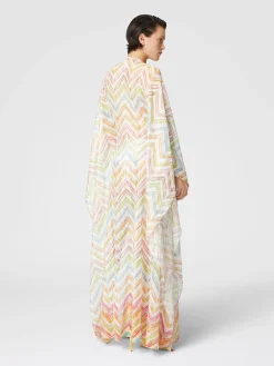 Long covered up in printed tulle with batwing sleeves