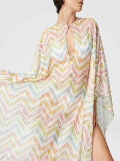 Long covered up in printed tulle with batwing sleeves