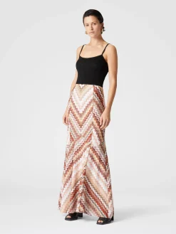 Long flared skirt with lamé serrated zig zag pattern