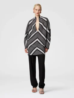 Mini-dress with oversized sleeves and plunging V-neckline