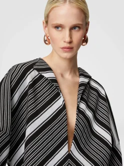 Mini-dress with oversized sleeves and plunging V-neckline