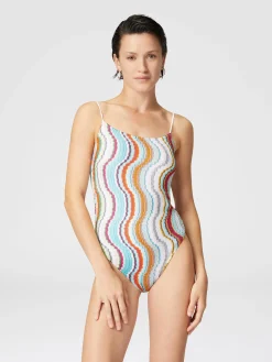 One-piece swimsuit with lamé wave pattern