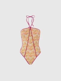 Reversible one-piece swimsuit with print and contrasting piping