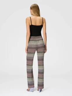 Straight trousers with glare-patterned zig zag lamé