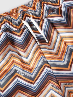 Swim shorts with zig zag print and logo